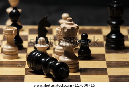 chess pieces on a chess board table