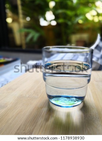 Picture of a glass of water with clean water in a glass and a relaxing, refreshing atmosphere. For good health