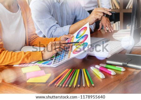Graphic design and color swatches and pens on a desk. Architectural drawing with work tools and accessories. 
