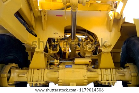 Transmission heavy construction machinery of bright yellow color.