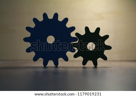 colored wooden wheels gear on wooden table