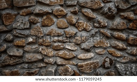 Old grunge and dirty stone structure of retro style stone wall background and texture.