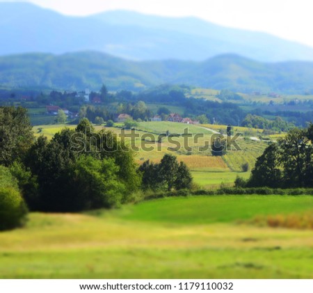 Scenic mountain landscape, summer green meadows,green fields