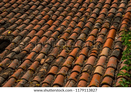 Old roof of tiles Royalty-Free Stock Photo #1179113827