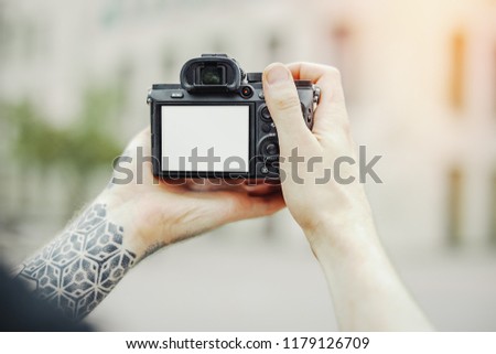 Close up of man hands holding camera