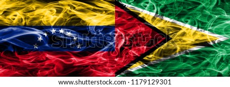 Venezuela vs Guyana colorful concept smoke flags placed side by side