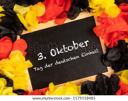 German Text 3. Oktober Tag der deutschen Einheit, in english, 3. October, day of german unity with national colors  Royalty-Free Stock Photo #1179158485