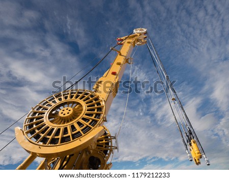 Elements of large mobile construction cranes tower on blue sky background 