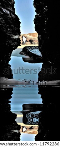 photography with reflection in the water of the famous stone arches of the beach of the cathedrals, galicia, spain,peace, harmony, tranquility, serenity, meditation, transcendence, relaxation, balance