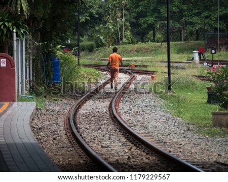 Young man on the railroad
