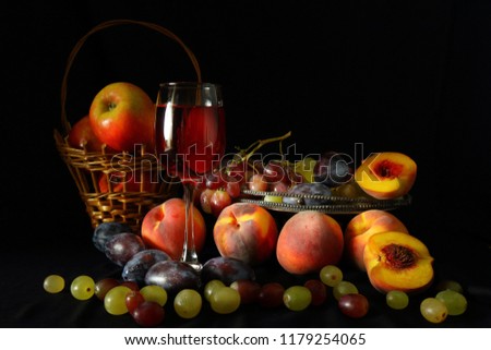 Basket of apples, vase with grapes, peaches, plums and a glass of red wine on a dark background in the style of ancient Dutch artists