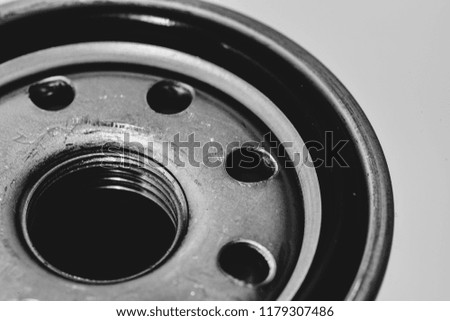 Monochrome background image of oil filter close up. Artwork from auto part in macro photography in grayscale.