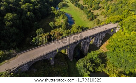 Stunning aerial view of a bridge, viaduct in the Peak District National park in England, Bakewell, UK