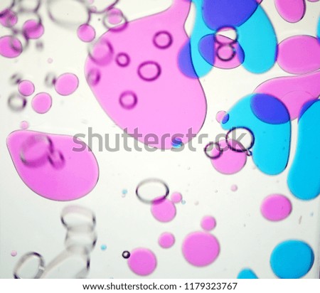 Pink, blue, blue, bubbles in the water. Create a compelling picture.