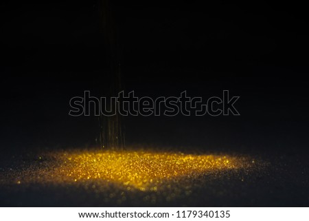 Abstract background texture Sprinkle gold dust in the dark with copy space.