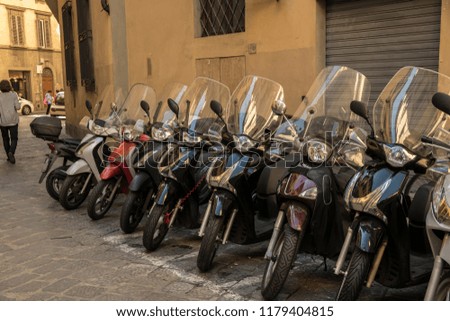 Colorful motorbikes parked in street of Florence, Tuscany, Italy