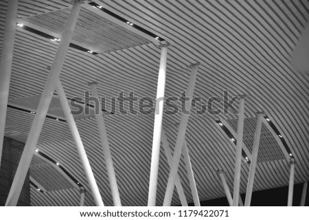 Stylish metallic interior pillars of a building's ceiling isolated unique photo
