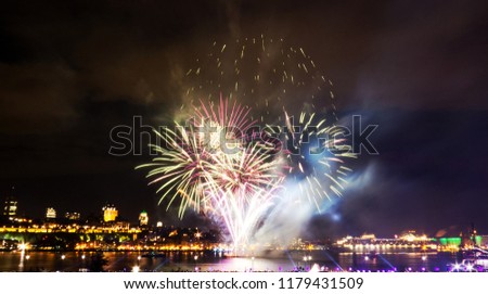 Light green fireworks during a summer festival in Quebec City, Canada.