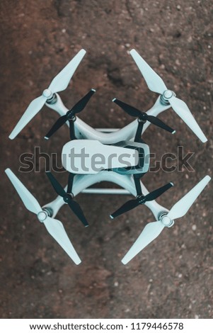 Two drones on each other, quadcopters on ground