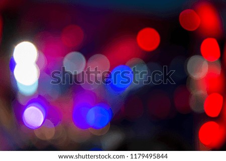 Bright lights at the concert at night, blurred background, image out of focus
