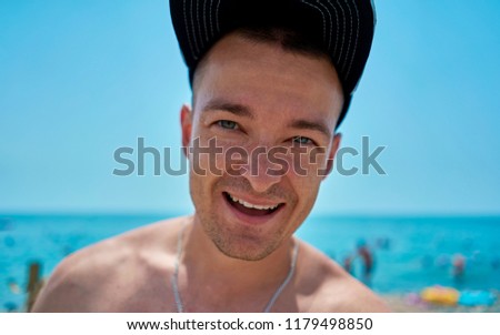 man in the cap on the beach