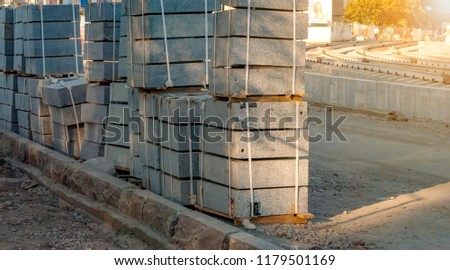 Concrete blocks on wooden pallets before using on the road