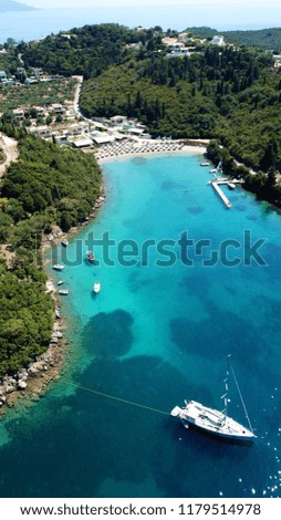 Aerial bird's eye view photo taken by drone of tropical complex islands and sandy beach with turquoise clear waters and pine trees
