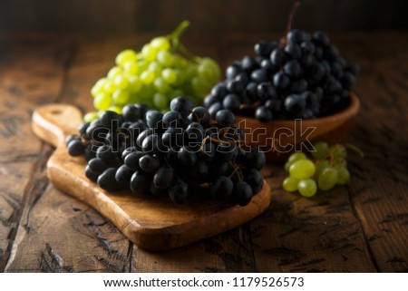 Fresh ripe grape on the wooden table
