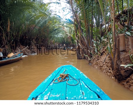 Pictures of sailing in the canal of the river Mekong in Vietnam.