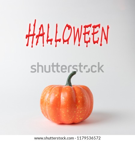 Halloween pumpkin on white background. Halloween minimal concept.