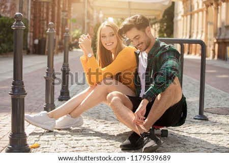 Photo of a happy young beautiful couple having fun together in the city.