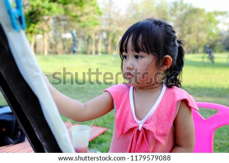 Girl drawing in the park