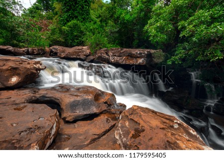 La-O waterfall in tropical forest Thailand leaf moving low speed shutter blur.Unseen in Sisaket province,Thailand,ASIA.