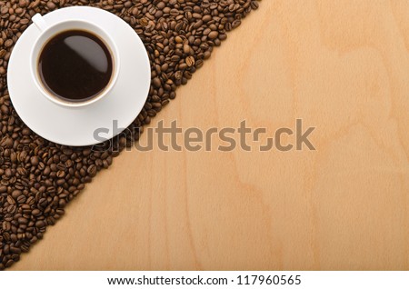  A cup of coffee and wooden background