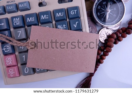 Business and Finance Conceptual with tag,compass and coins. Copy space