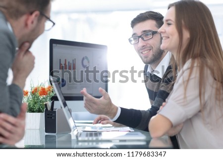 business team discussing financial charts