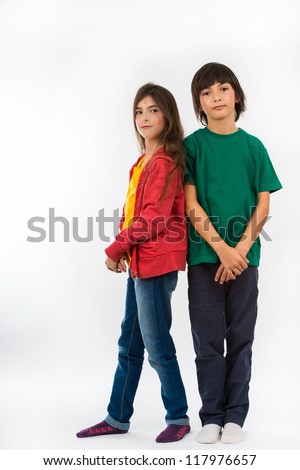 Girl and boy posing on white background