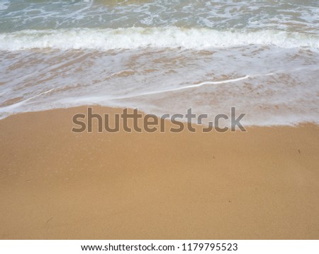 Beach and soft wave of the sea