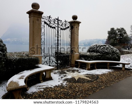 Romantic snowy door on the Lugano Lake, Swiss 