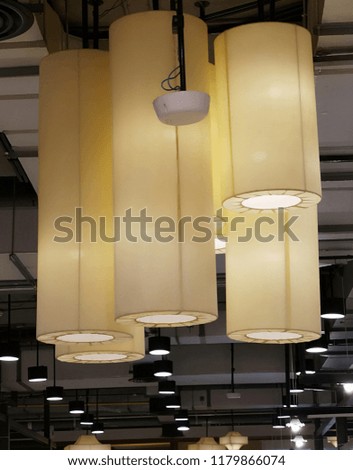 The lamp is designed to hang on the ceiling.