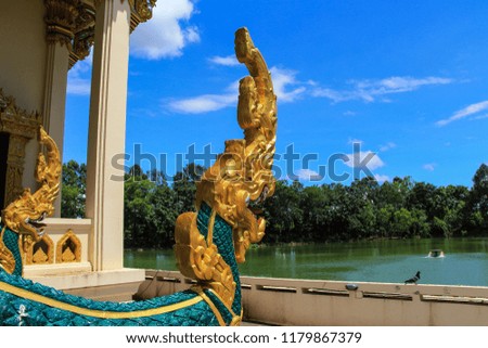 Golden naga statue Thai dragon in Buddhism temple Thailand 