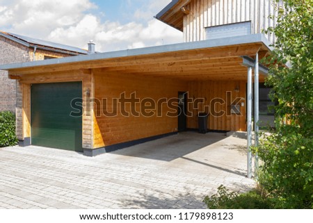 wooden and modern carport in south germany bavarian village area Royalty-Free Stock Photo #1179898123