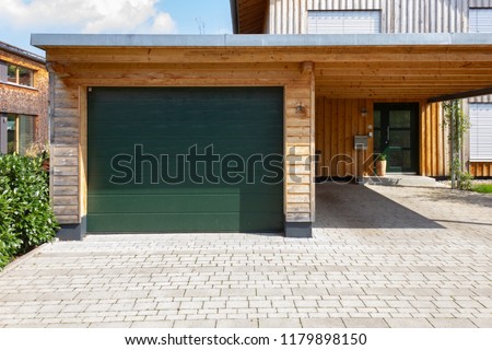 wooden and modern carport in south germany bavarian village area Royalty-Free Stock Photo #1179898150