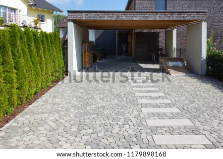 wooden and modern carport in south germany bavarian village area Royalty-Free Stock Photo #1179898168