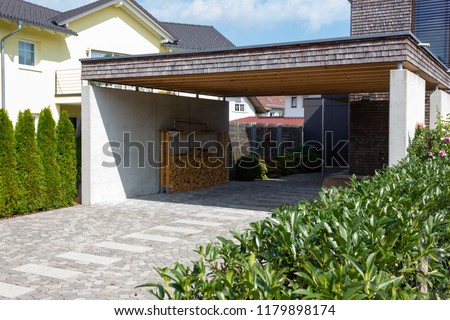 wooden and modern carport in south germany bavarian village area Royalty-Free Stock Photo #1179898174