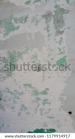 Worn painted, distorted peeled wall image.