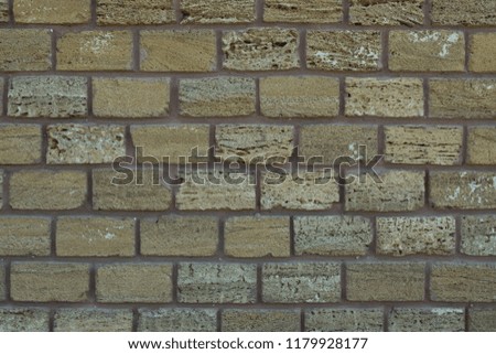 Texture, background of an old brick wall.  Texture of wall made of shell brick.