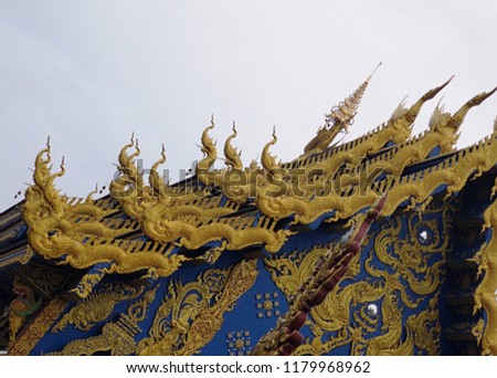 Traditional Thai style Naga on the roof in temple