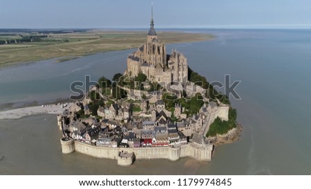 Aerial picture Mont Saint-Michel a town located in Normandy west of Paris it consists of an abbey and monastery on top and below great halls then stores and housing on the side of the fortification