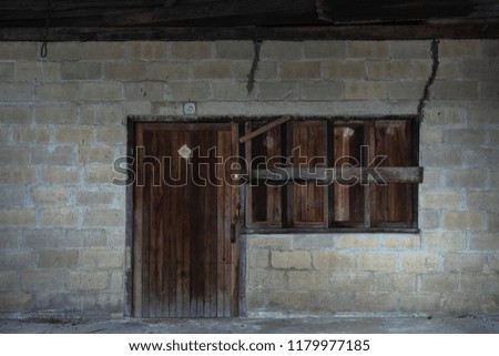 old door and windows of concrete building
